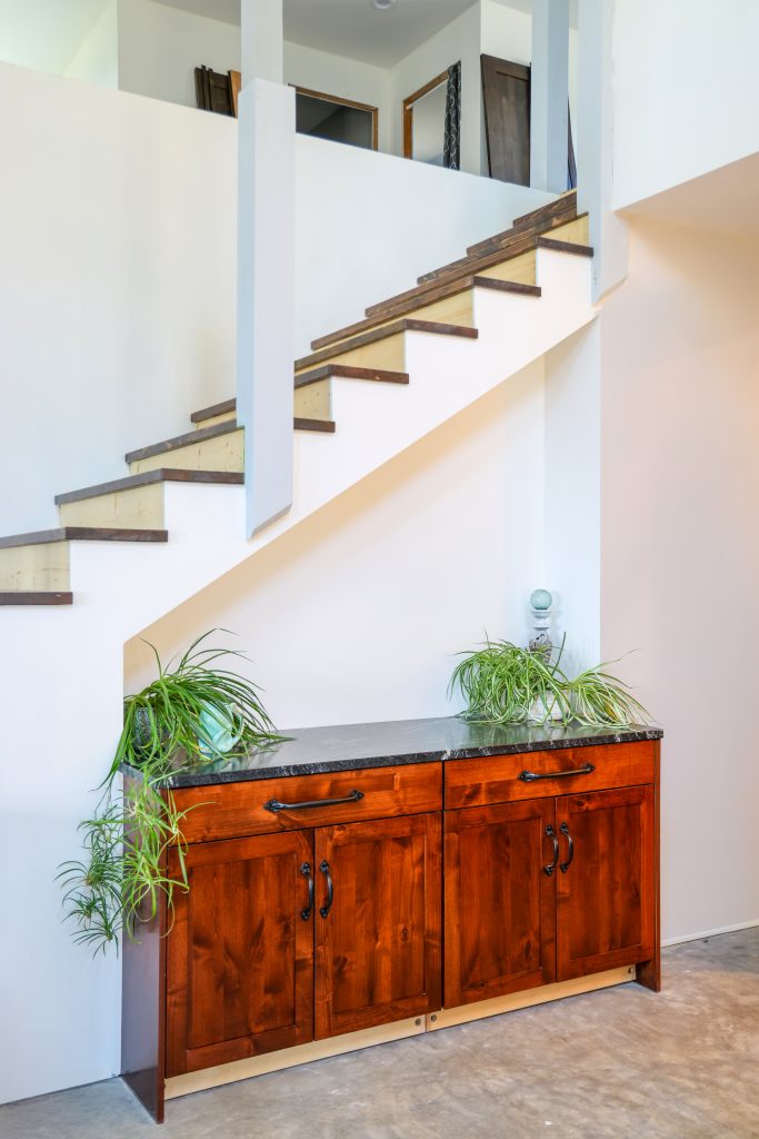 Custom cabinets under the stairway. Minimalistic and modern.